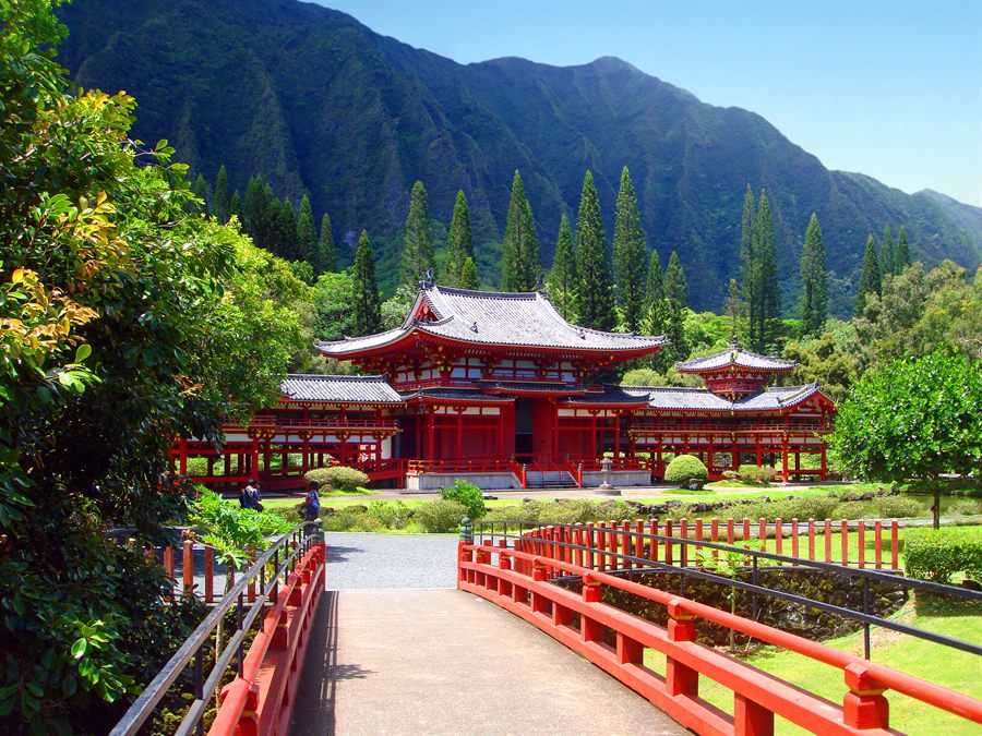Red Byodo-In Temple below the green cliffs of the Koolau range on Oahu